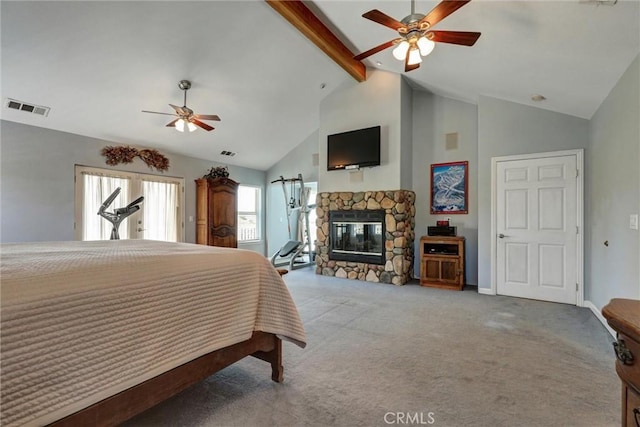 carpeted bedroom with ceiling fan, high vaulted ceiling, beamed ceiling, and a fireplace
