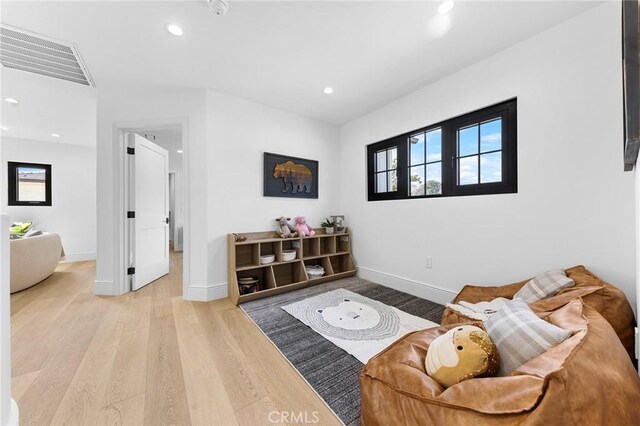 sitting room with light wood-type flooring