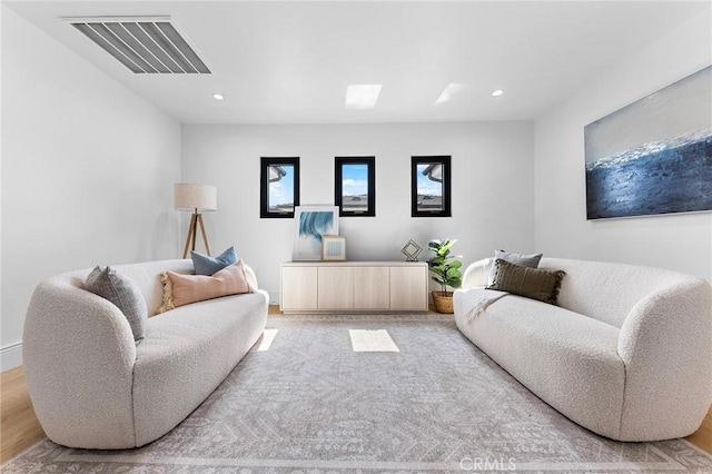 living room with light hardwood / wood-style flooring