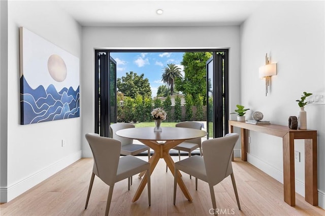 dining room featuring light hardwood / wood-style flooring