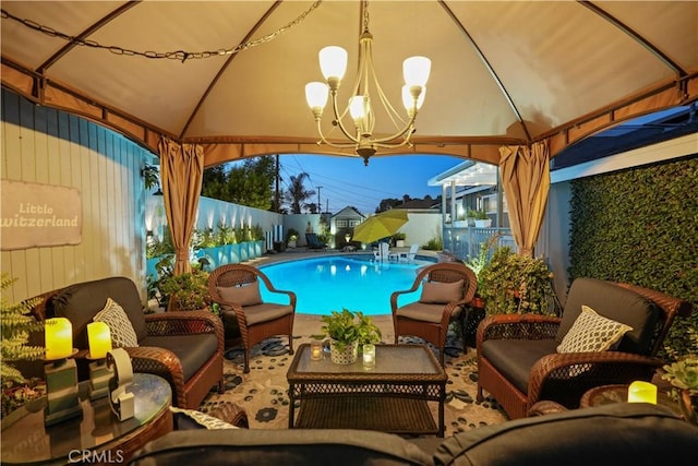 view of swimming pool with an outdoor hangout area and a gazebo