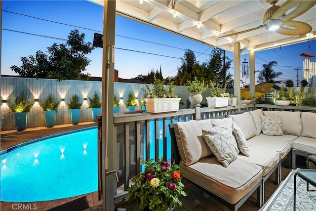 view of swimming pool with a wooden deck and outdoor lounge area