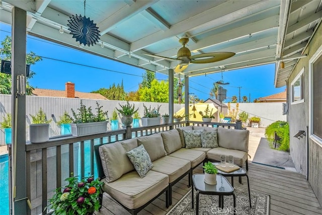 exterior space with ceiling fan and outdoor lounge area