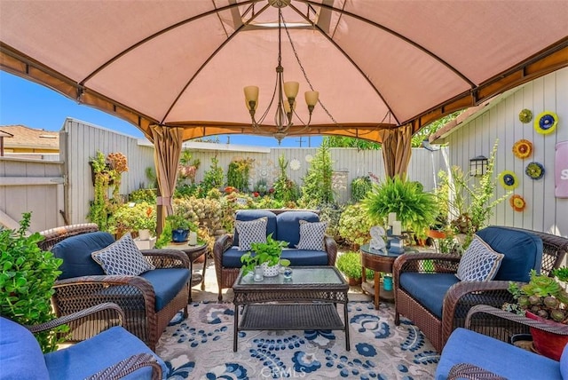 view of patio featuring an outdoor hangout area and a gazebo