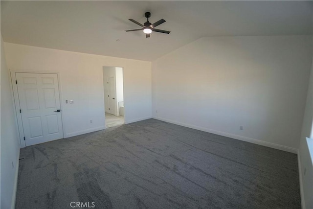 carpeted empty room featuring ceiling fan and lofted ceiling