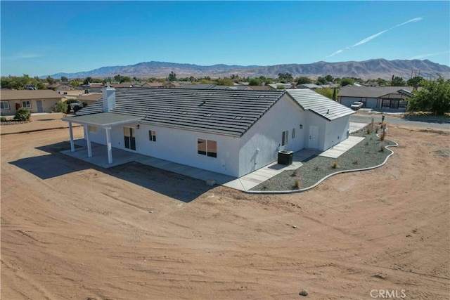 exterior space featuring a mountain view