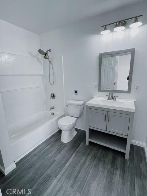 full bathroom featuring toilet, vanity, shower / tub combination, and hardwood / wood-style flooring