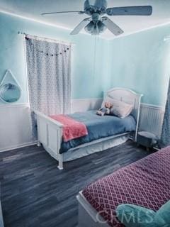 bedroom with ceiling fan and dark wood-type flooring