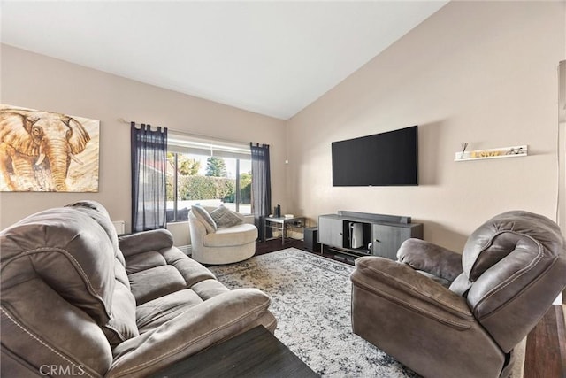 living room featuring hardwood / wood-style flooring and vaulted ceiling