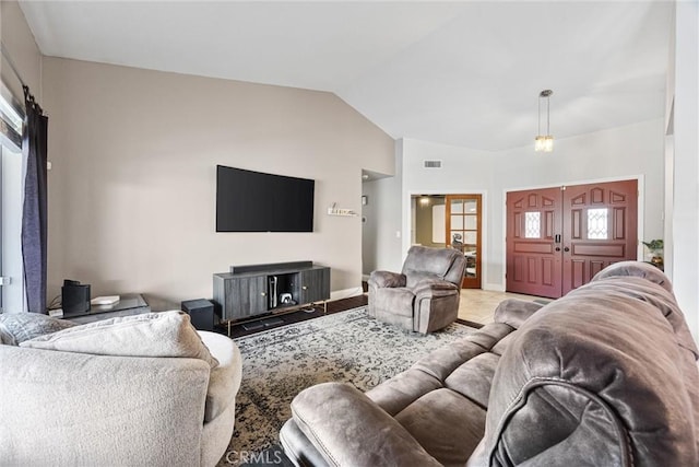 living room with lofted ceiling