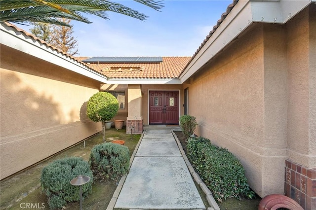 property entrance with solar panels