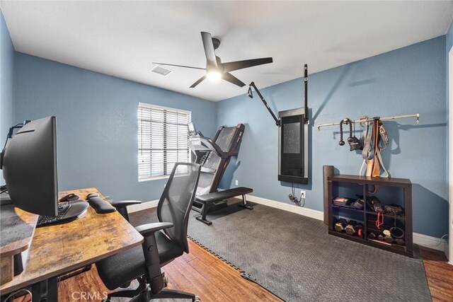 home office featuring ceiling fan and wood-type flooring