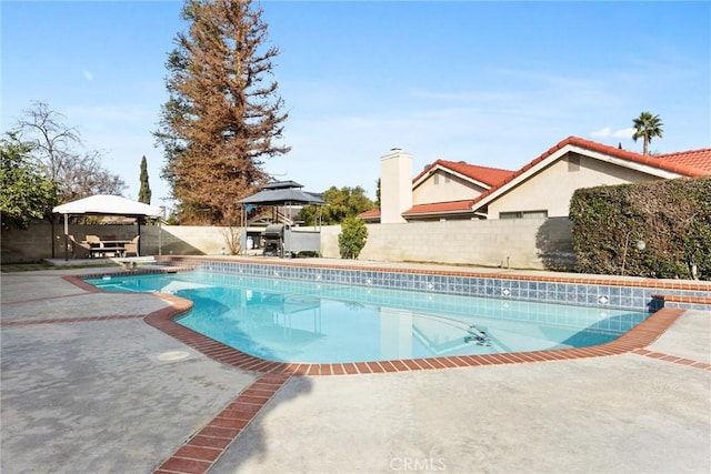 view of pool with a patio area and a gazebo