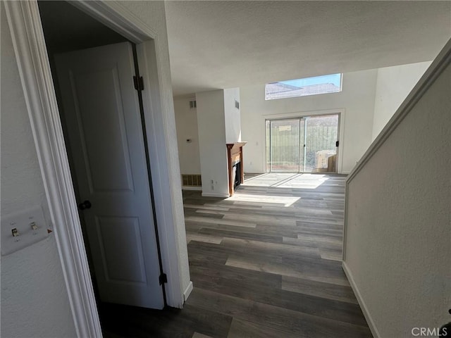 hall featuring dark wood-type flooring