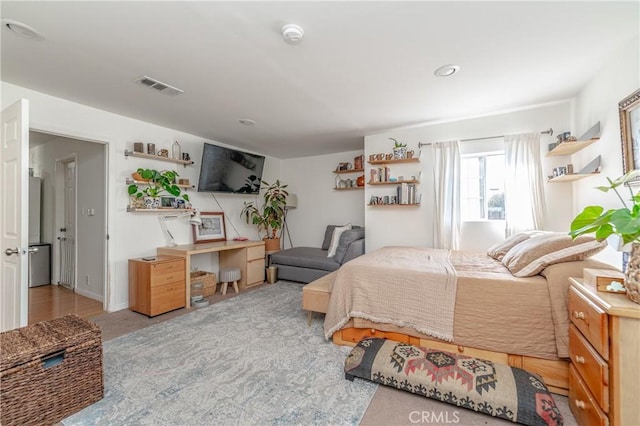 carpeted bedroom with visible vents