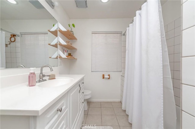 full bathroom with baseboards, toilet, tile patterned floors, curtained shower, and vanity