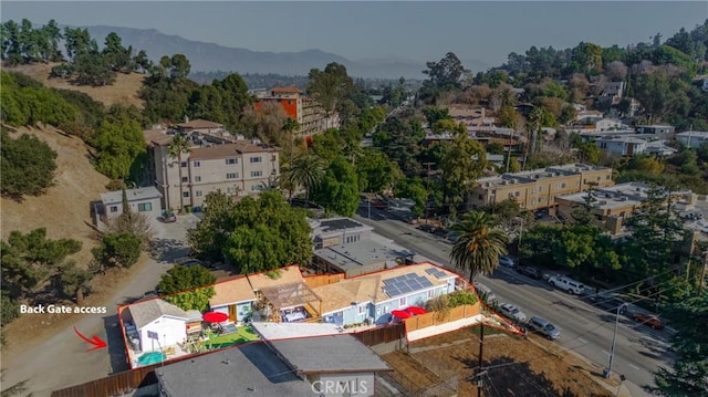 birds eye view of property featuring a mountain view