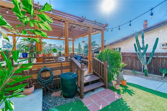 view of jungle gym with fence, a pergola, and a wooden deck