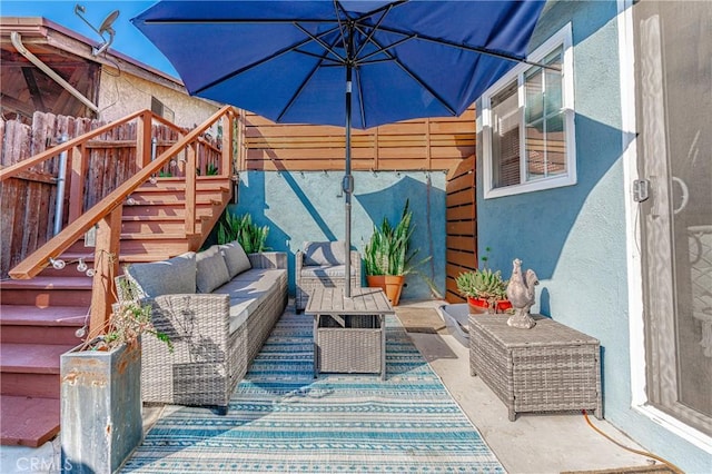 view of patio with an outdoor hangout area and stairway