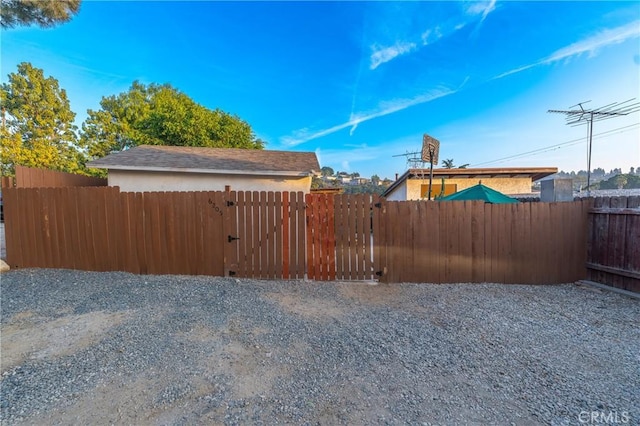 view of yard with fence and a gate