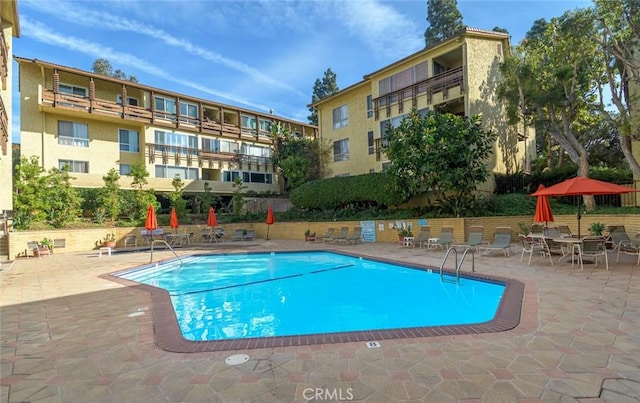 view of swimming pool with a patio area