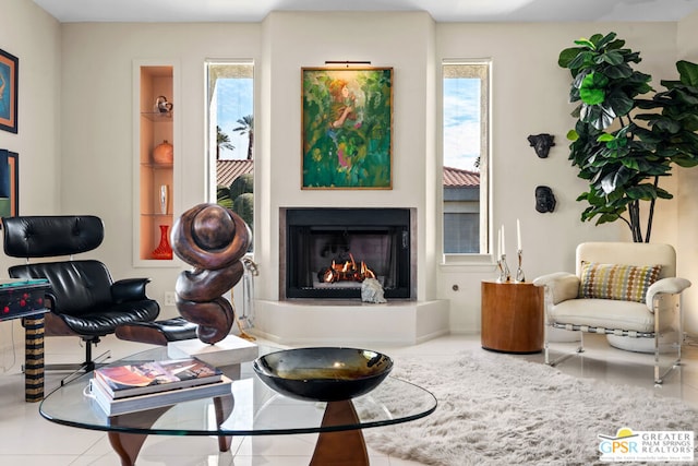 living area with tile patterned flooring