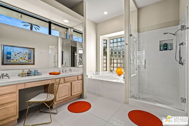 bathroom featuring vanity, independent shower and bath, and tile patterned flooring