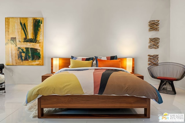 bedroom with light tile patterned floors