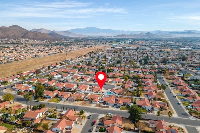 birds eye view of property with a mountain view