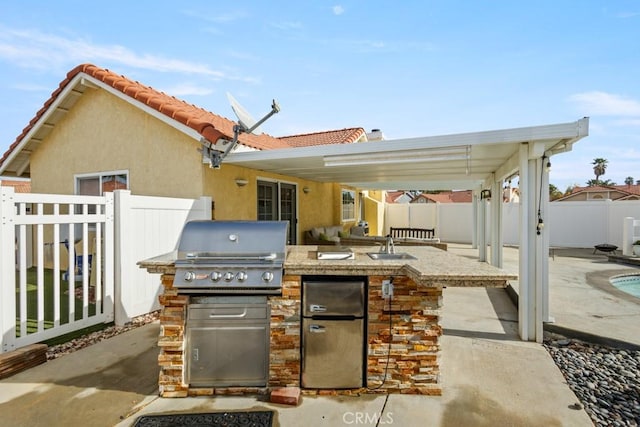 view of patio / terrace with a grill and area for grilling