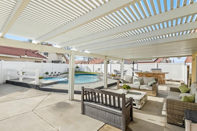 view of patio / terrace featuring an outdoor hangout area, a fenced in pool, a pergola, and exterior bar