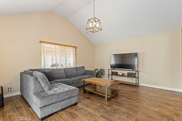 living room featuring an inviting chandelier and lofted ceiling