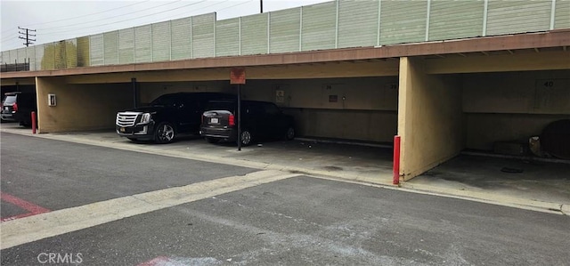 view of parking / parking lot with a carport