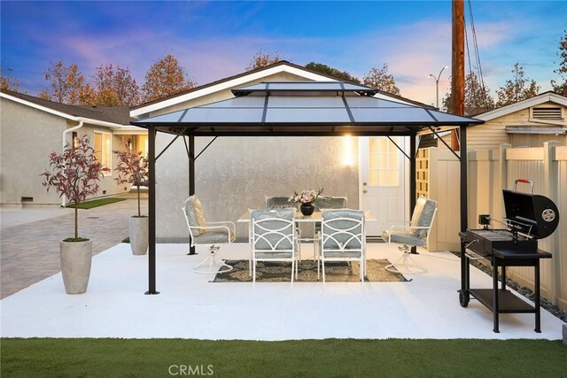 patio terrace at dusk with a gazebo