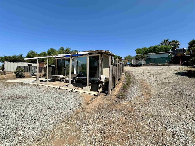 rear view of house featuring a patio