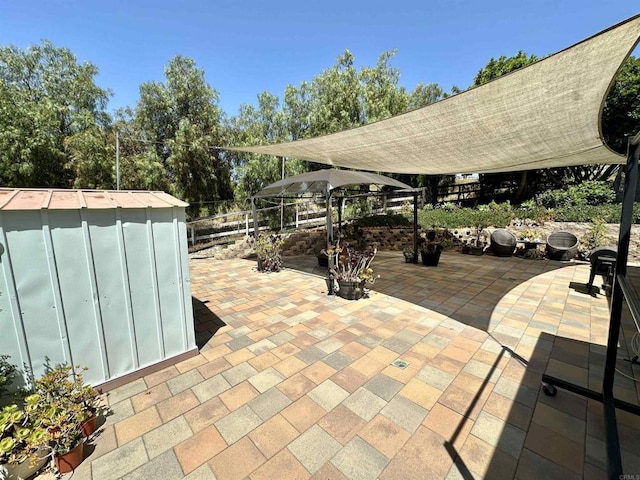 view of patio / terrace with a storage shed