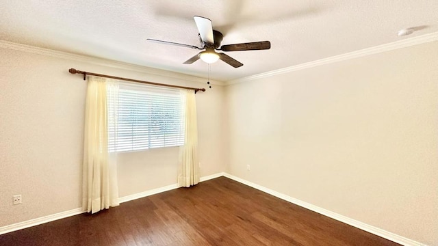 empty room with ceiling fan, dark hardwood / wood-style floors, and ornamental molding