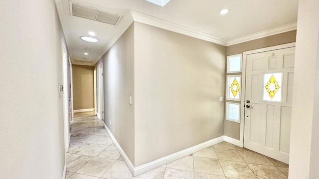 tiled entrance foyer featuring ornamental molding