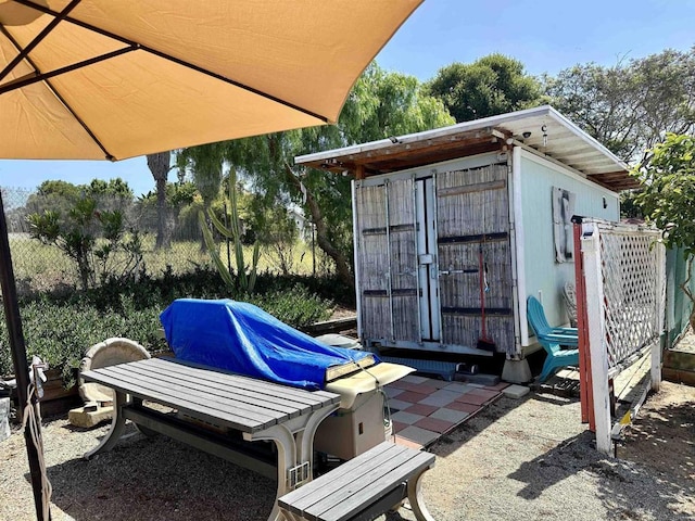 exterior space with a shed