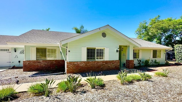 single story home featuring a garage