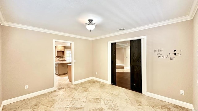 unfurnished room with crown molding