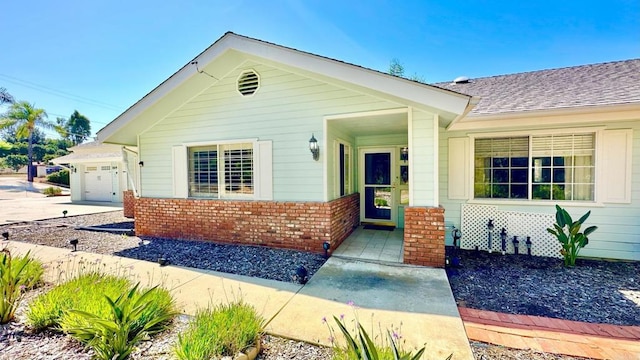 view of front of home with a garage and a porch