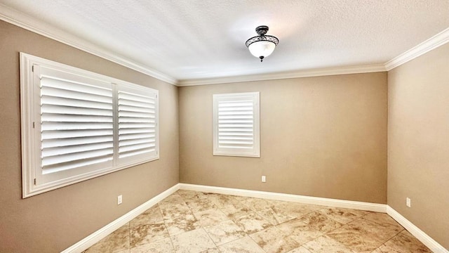 empty room with ornamental molding and a textured ceiling