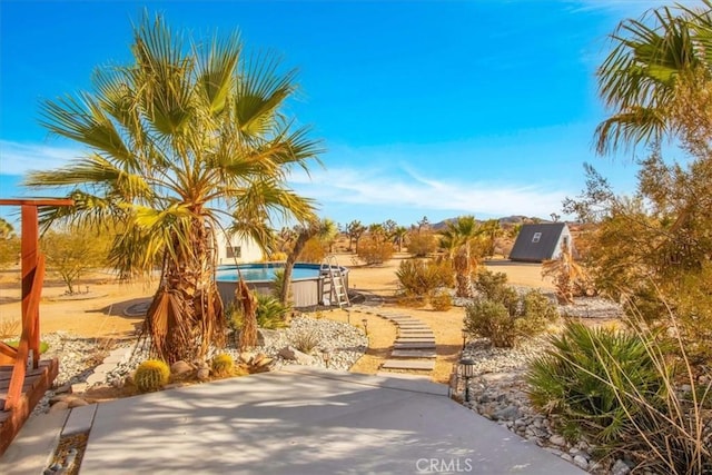 59427 La Crescenta Dr, Yucca Valley, CA 92284 - exterior space with an outdoor pool