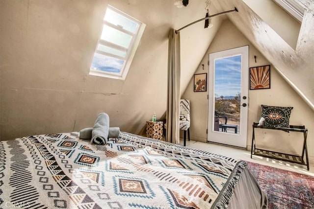 59427 La Crescenta Dr, Yucca Valley, CA 92284 - bedroom with vaulted ceiling with skylight and access to exterior