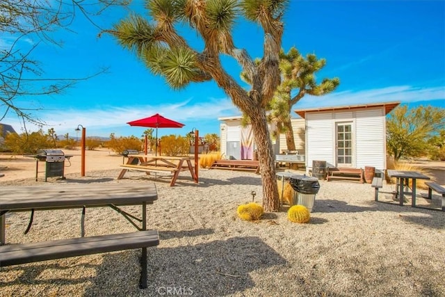 view of play area featuring a storage shed