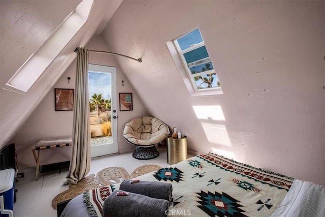 59427 La Crescenta Dr, Yucca Valley, CA 92284 - bedroom featuring vaulted ceiling with skylight, access to exterior, and multiple windows