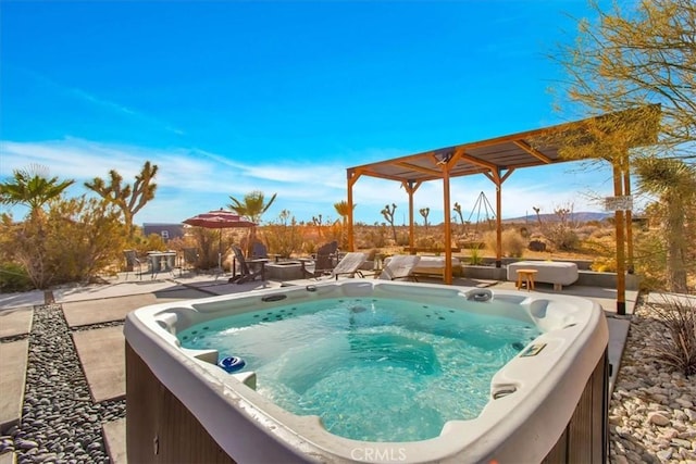 view of pool featuring a hot tub and a patio