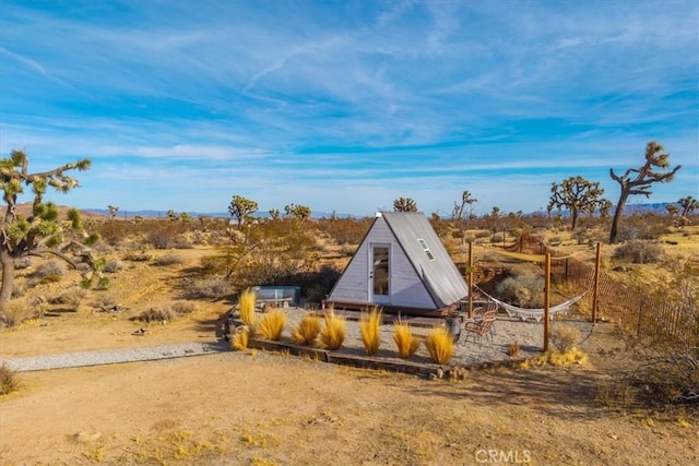 59427 La Crescenta Dr, Yucca Valley, CA 92284 - entry to storm shelter with an outdoor structure