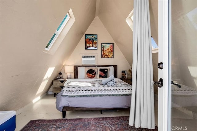 bedroom featuring an AC wall unit and lofted ceiling with skylight